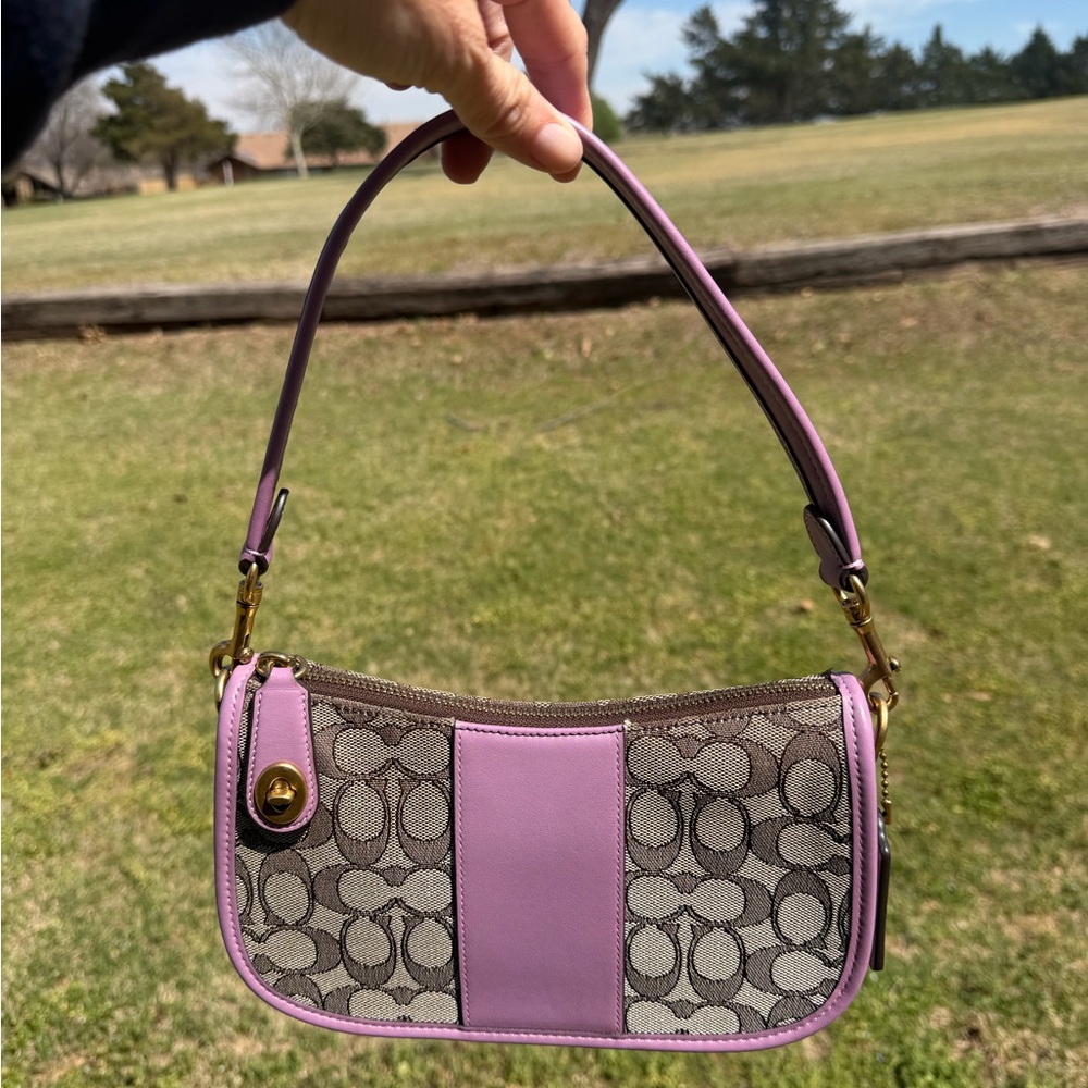 Coach Swinger In Signature Jacquard and purple accent